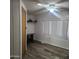 Cozy bedroom includes vinyl floors, a ceiling fan, and ample natural light through the window at 3160 E Main St # 72, Mesa, AZ 85213