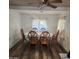 Dining area features a ceiling fan and large windows, creating a comfortable space at 3160 E Main St # 72, Mesa, AZ 85213