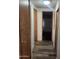 Hallway featuring wood-look vinyl flooring and neutral walls leading to the bedroom at 3160 E Main St # 72, Mesa, AZ 85213