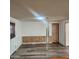 Open-concept living room with modern wood-look floors and ample natural light at 3160 E Main St # 72, Mesa, AZ 85213