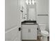 Clean bathroom with white cabinets, black hardware and granite countertop at 3875 E Appaloosa Rd, Gilbert, AZ 85296