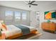 Bedroom with ceiling fan, ample natural light, and en suite bath at 3875 E Appaloosa Rd, Gilbert, AZ 85296