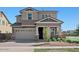 Inviting two-story home with a two car garage and manicured front yard at 3875 E Appaloosa Rd, Gilbert, AZ 85296