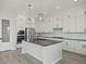 Modern kitchen featuring stainless steel appliances, an island, and white cabinets at 3875 E Appaloosa Rd, Gilbert, AZ 85296