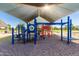 Community playground with covered play structure, swings, and climbing area at 3875 E Appaloosa Rd, Gilbert, AZ 85296