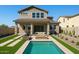Inviting backyard features a sparkling pool, fire pit, outdoor seating, and lush landscaping for relaxing outdoor living at 3875 E Appaloosa Rd, Gilbert, AZ 85296