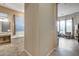 Bright primary bathroom featuring tiled floors, soaking tub and views out of the window at 42001 N Bridlewood Way, Phoenix, AZ 85086