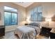 Cozy bedroom with hardwood floors, large window, neutral paint and plenty of natural light at 42001 N Bridlewood Way, Phoenix, AZ 85086