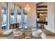 Cozy breakfast nook featuring built-in seating, a decorative chandelier, and a view of the backyard at 42001 N Bridlewood Way, Phoenix, AZ 85086