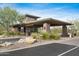 Community entrance gatehouse featuring well-maintained desert landscaping and controlled access at 42001 N Bridlewood Way, Phoenix, AZ 85086