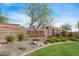 Entrance to Anthem Country Club with well-manicured landscaping, decorative rocks, and signage at 42001 N Bridlewood Way, Phoenix, AZ 85086