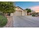 Well maintained home with a three car garage, beautiful desert landscape and mature trees at 42001 N Bridlewood Way, Phoenix, AZ 85086