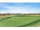 Expansive golf course with rolling greens and desert views creating a scenic golfing experience at 42001 N Bridlewood Way, Phoenix, AZ 85086