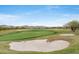 Picturesque golf course with lush green fairways, bunkers, and mountain views in the background at 42001 N Bridlewood Way, Phoenix, AZ 85086