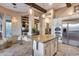 Beautiful kitchen with a granite island, stainless steel appliances, and a cozy breakfast nook at 42001 N Bridlewood Way, Phoenix, AZ 85086