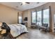 Spacious main bedroom features hardwood floors, many windows, sitting area, and neutral paint at 42001 N Bridlewood Way, Phoenix, AZ 85086