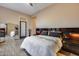 Comfortable main bedroom with hardwood floors, mirrored wall and neutral paint at 42001 N Bridlewood Way, Phoenix, AZ 85086