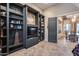 Comfortable office with custom shelving units and natural lighting from a large window at 42001 N Bridlewood Way, Phoenix, AZ 85086
