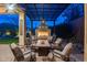 Beautiful outdoor area showcasing a fireplace, comfortable seating, and stylish pergola at 42001 N Bridlewood Way, Phoenix, AZ 85086