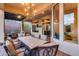 Large covered patio features dining area, chandelier, and outdoor living space at 42001 N Bridlewood Way, Phoenix, AZ 85086
