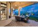 Gorgeous patio with a dining table, ceiling fan, and views of the landscaped backyard at 42001 N Bridlewood Way, Phoenix, AZ 85086