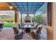 Spacious patio with a pergola, fireplace, comfortable seating, and landscaped backyard at 42001 N Bridlewood Way, Phoenix, AZ 85086