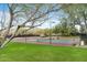 Outdoor tennis courts with well-maintained playing surfaces and surrounding green space at 42001 N Bridlewood Way, Phoenix, AZ 85086
