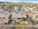 An aerial view of a single-Gathering home showcases mature landscaping and mountain views at 4401 E Walatowa St, Phoenix, AZ 85044