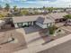 Aerial showcases desert landscaping and ample parking on a wide cozy street at 4401 E Walatowa St, Phoenix, AZ 85044