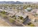 This aerial view showcases a community neighborhood with desert landscaping and mountain views at 4401 E Walatowa St, Phoenix, AZ 85044
