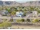 An aerial view shows a community neighborhood with desert landscaping and mountain views at 4401 E Walatowa St, Phoenix, AZ 85044