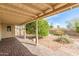 Covered back patio features brick pavers and view of the landscaped yard at 4401 E Walatowa St, Phoenix, AZ 85044