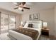 Inviting bedroom with king-size bed, sliding glass doors, and stylish décor at 4401 E Walatowa St, Phoenix, AZ 85044