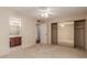 A bright bedroom showing the closet and access to the ensuite bathroom at 4401 E Walatowa St, Phoenix, AZ 85044