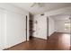 Bright bedroom with wood floors, a ceiling fan, closet and built-in shelves at 4401 E Walatowa St, Phoenix, AZ 85044