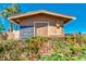 Charming community garden shed surrounded by lush greenery and flowers, perfect for outdoor enthusiasts at 4401 E Walatowa St, Phoenix, AZ 85044