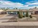 Charming home boasts desert landscaping and an inviting exterior at 4401 E Walatowa St, Phoenix, AZ 85044