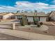 Inviting home showcases desert landscaping with gravel and cacti at 4401 E Walatowa St, Phoenix, AZ 85044