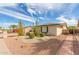 Single-story home with desert landscaping, gravel accents, and mature cacti at 4401 E Walatowa St, Phoenix, AZ 85044