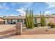 Charming single-story home with desert landscaping, including cacti and gravel accents at 4401 E Walatowa St, Phoenix, AZ 85044