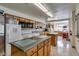 Functional kitchen with stainless steel appliances, ample cabinet space, and tiled floors at 4401 E Walatowa St, Phoenix, AZ 85044