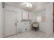 Laundry room with a utility sink, cabinets and tile floors at 4401 E Walatowa St, Phoenix, AZ 85044