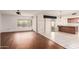 Bright, open-concept living room with wood-look floors and backyard view at 4401 E Walatowa St, Phoenix, AZ 85044