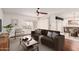 Bright living room featuring modern furnishings, a ceiling fan, and neutral tones throughout at 4401 E Walatowa St, Phoenix, AZ 85044
