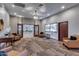 Inviting lobby with comfortable seating, display case, and entry to another room with conference table and chairs at 4401 E Walatowa St, Phoenix, AZ 85044