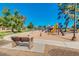 Community playground with colorful slides, a bench and playing area for children to enjoy in a safe and fun environment at 4401 E Walatowa St, Phoenix, AZ 85044