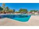 Inviting swimming pool with clear blue water, lounge chairs, and shade umbrellas at 4401 E Walatowa St, Phoenix, AZ 85044