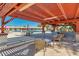 Charming poolside seating under a shaded pergola with views of the inviting pool at 4401 E Walatowa St, Phoenix, AZ 85044