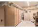 Large storage area in a garage with work bench and hot water tank at 4401 E Walatowa St, Phoenix, AZ 85044