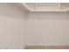 Walk-in closet space offering multiple shelves and ample storage at 4401 E Walatowa St, Phoenix, AZ 85044